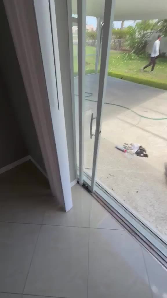 CaliberFix technician servicing a sliding glass door