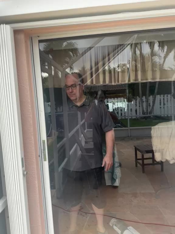 Sliding door track being cleaned and serviced
